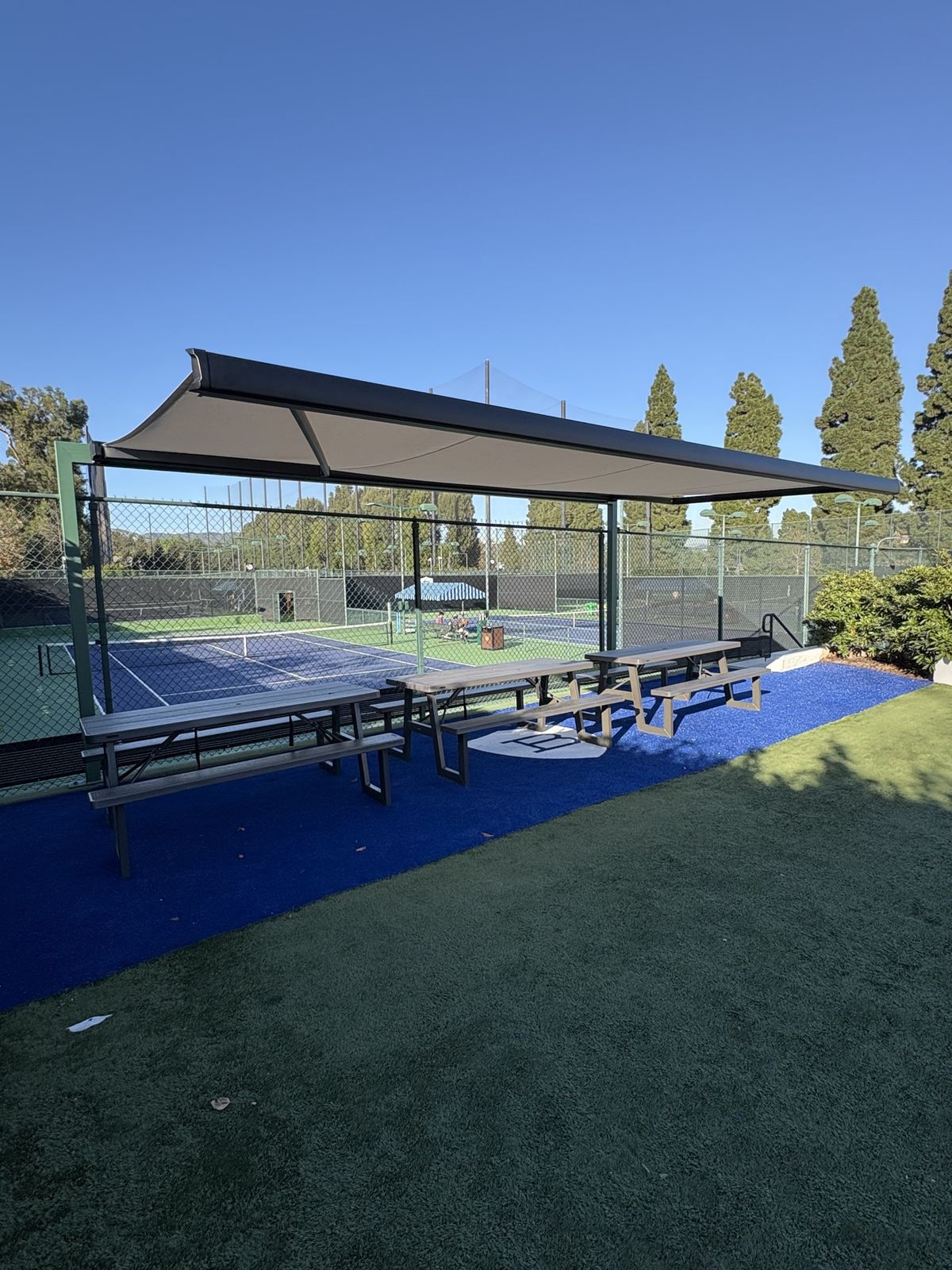 Large awning over a tennis-court picnic area, AJ Shades commercial shade project